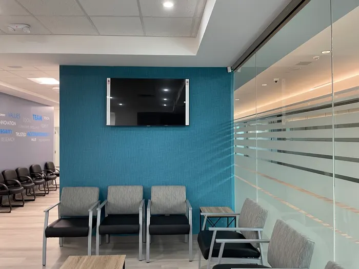Interior of Bo Li Laser Clinic waiting area with frosted glass and chairs
