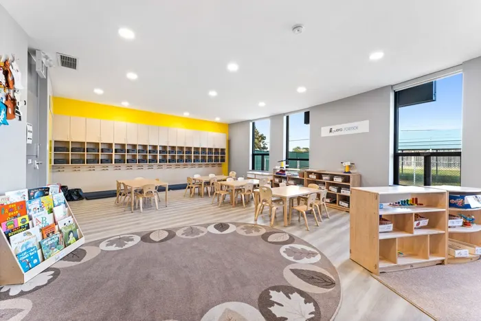 Completed CEFA daycare classroom with cubbies, tables, chairs, and shelving
